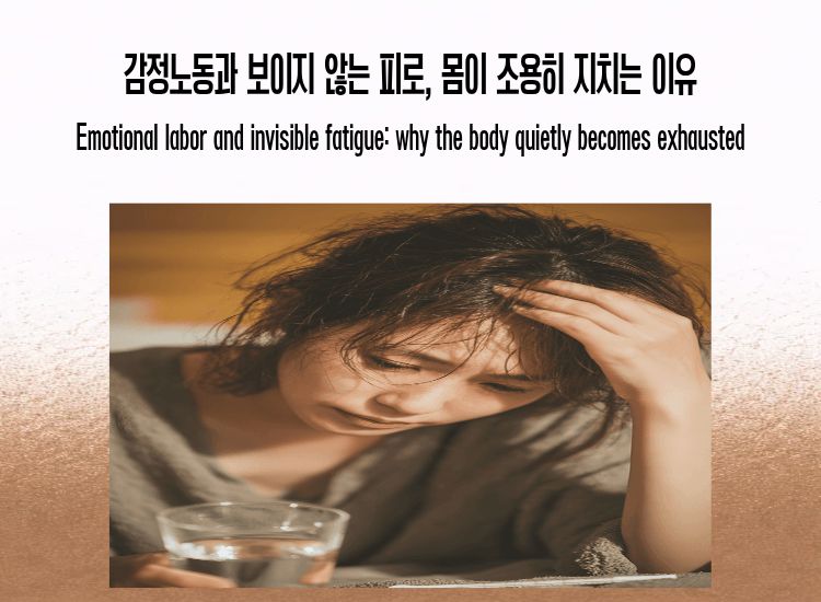 A tired woman holding her head, representing emotional labor and invisible fatigue